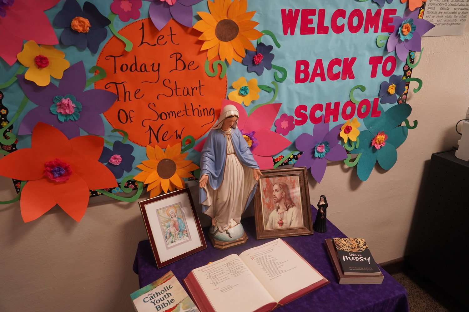 A Prayer table and bulletin board adorn the first floor hallway of St. Mary School in Glasgow.